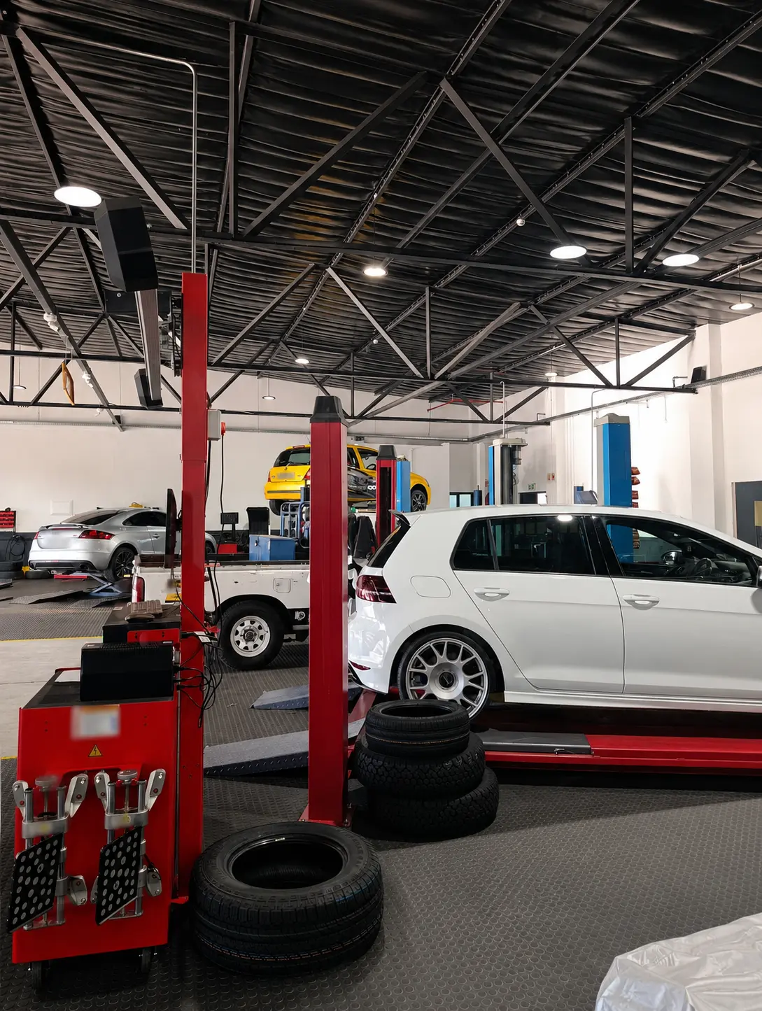 Customer vehicles in a performance workshop