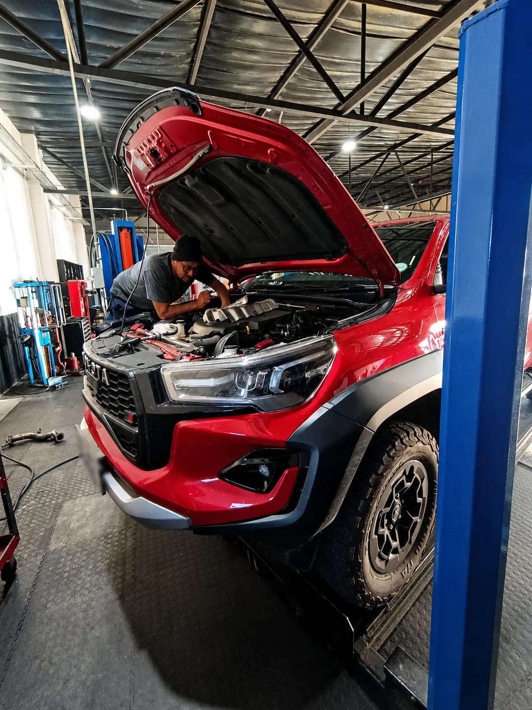 Technician working on a Toyota Hilux in the Cape Town workshop